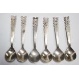 A set of six Art Deco silver spoons, each with fig shaped bowl and pierced handle, London 1935 by