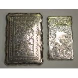 A Victorian silver shaped rectangular card case, engraved with leaves, Birmingham 1882 by Cohen &