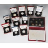 A group of ten Royal Mint commemorative silver coins, comprising two five pounds, four two pounds,