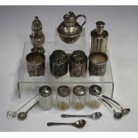 A Chinese silver four-piece condiment set, each piece of cylindrical form, a Chinese silver pepper
