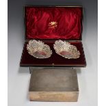 A pair of late Victorian silver shaped oval bonbon dishes with pierced and embossed lattice and