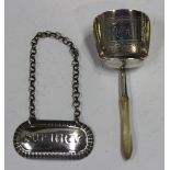 A George III silver tea caddy shovel, the bowl with engraved initials, fitted with a turned mother-
