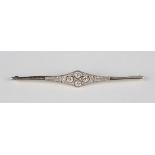 A diamond bar brooch in an Art Deco style, collet set with the four principal circular cut