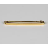 A gold plain bar brooch, detailed '9ct', weight 2.6g, width 4.5cm.Buyer’s Premium 29.4% (including