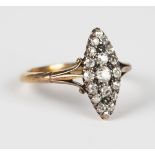 A gold and diamond marquise shaped cluster ring, mounted with cushion cut diamonds between split