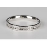 An 18ct white gold and diamond half eternity ring, channel set with a row of circular cut