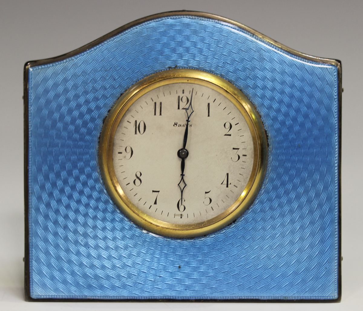 An Art Deco silver and pale blue enamelled bedside timepiece, the silvered dial with Arabic hour