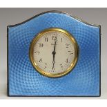 An Art Deco silver and pale blue enamelled bedside timepiece, the silvered dial with Arabic hour