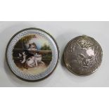 A Continental silver and enamelled circular box and cover, the enamelled top painted with a scene of