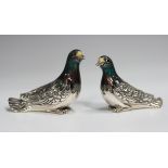 A graduated pair of Italian Saturno silver and enamelled figures of wood pigeons, import mark