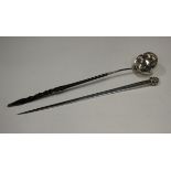 A George III silver meat skewer with scallop shell, London 1768 by W.A., weight 117g, length 34.5cm,