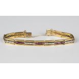 A Hungarian gold, ruby and diamond bracelet, mid-20th century, in a rectangular triple bar link