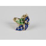 An 18ct gold, blue and green enamelled and diamond set ring in a foliate design, claw set with