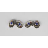 A pair of silver and enamelled oval cufflinks, decorated with the pennants of the Royal Naval