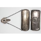A George V silver spectacles case with sprung hinged lid, fitted with a chain and châtelaine clip,