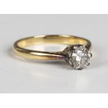 A gold and diamond single stone ring, claw set with a circular cut diamond, detailed '18ct',