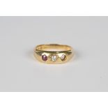 A Victorian 18ct gold ring, star gypsy set with a cushion cut diamond and a cushion cut ruby,