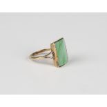 A gold ring, mounted with a curved rectangular jade, detailed '9ct', weight 4.2g, ring size approx