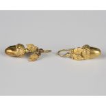 Two similar Victorian gold pendant earrings, each with an acorn drop and foliate surmount, with wire