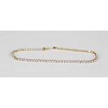 A 9ct gold and diamond bracelet, designed as a row of circular cut diamonds, on a snap clasp,