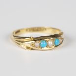 An Edwardian 18ct gold, turquoise and seed pearl ring in a boat shaped setting, Birmingham 1907,