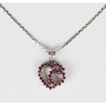 A white gold, ruby and diamond pendant, mounted with circular cut rubies to the twin heart shaped