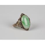 A Bernard Instone gold and jade ring, mounted with an oval jade between floral and foliate pierced