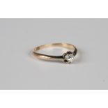 A gold ring, claw set with a cushion cut diamond, detailed '18ct', weight 1.8g, ring size approx