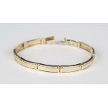 A two colour gold curved rectangular link bracelet with a snap clasp, marks indistinct, weight 18.