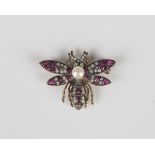 A ruby, diamond and cultured pearl brooch, designed as a winged insect, width 3.2cm, with an