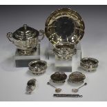 A pair of Victorian silver scallop shell salts, each raised on ball feet, with matching salt spoons,