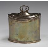 A George V silver oval tea caddy with reeded rims, the hinged lid with scroll finial, Chester 1915