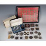 A collection of British and foreign coins and medallions, including a George III crown 1820, a