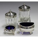 A pair of George III silver mounted cut glass pots, each facet cut body with silver rim and domed