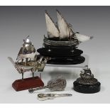 A Maltese .917 silver model of a Gozo sailing boat, on an ebonized oval base, height 12cm, a white