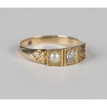 A Victorian gold ring, mounted with a cushion cut diamond in a square shaped setting with a half-