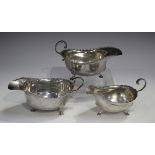 A George V silver sauceboat, London 1913 by Horace Woodward & Co Ltd, length 15.3cm, together with