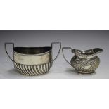 A late Victorian silver two-handled sugar bowl of half-reeded oval form, Sheffield 1900 by