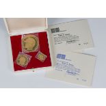 A set of three 22ct gold medallions, designed by Abraham Games to commemorate the 25th Anniversary