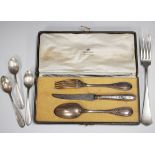 A French silver three-piece christening set, comprising fork, spoon and knife with steel handle,