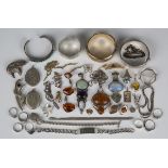 A group of silver, silver mounted and costume jewellery, including four bangles, four brooches,