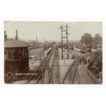 A group of 4 postcards of Sussex railway stations, including photographic postcards titled '