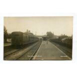 A collection of 18 postcards of railway stations in Surrey, including photographic postcards