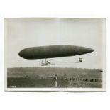 PHOTOGRAPHS. A group of twelve photographs of airships and early aviation, 13cm x 18cm.Buyer’s