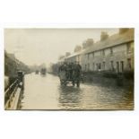 A collection of 20 postcards of Kent, including a view of a flooded road identified as Ashford and