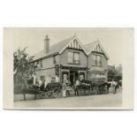 A photographic postcard of W.L. Gregory Bakery in Sedlescombe, East Sussex, with employees, horses