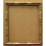 An early 20th century British gilt composition frame, rebate 50cm x 45.5cm, together with a large