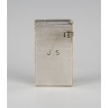 A Dunhill silver plated rectangular petrol lighter with engine turned decoration, initial