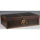 An early 20th century Louis Vuitton hard-sided travelling case with overall monogram and