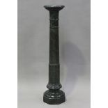 An early 20th century green serpentine sectional display pedestal, raised on an octagonal base,